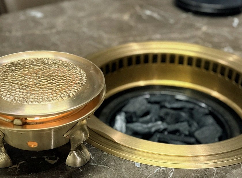 DAEBOJUNG Yeouido · the signature Hanwoo showing — marbled beef cuts and caviar presented in a display chest