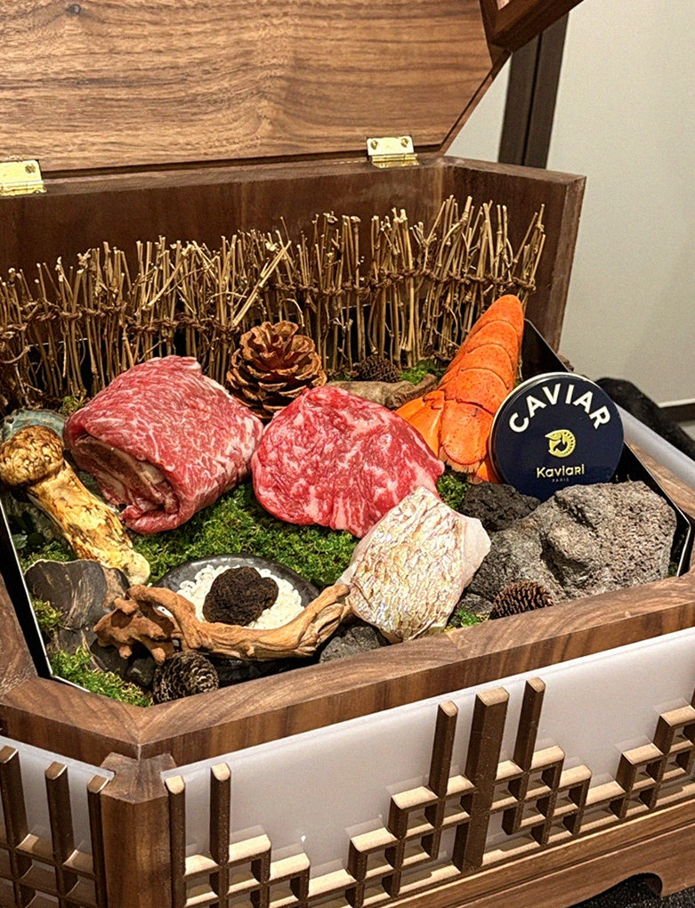 DAEBOJUNG Yeouido · the signature Hanwoo showing — marbled beef cuts and caviar presented in a display chest