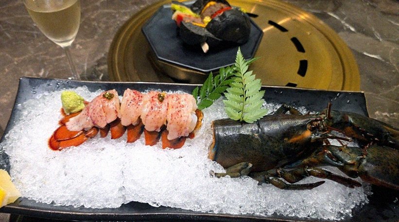 DAEBOJUNG Yeouido · the signature Hanwoo showing — marbled beef cuts and caviar presented in a display chest