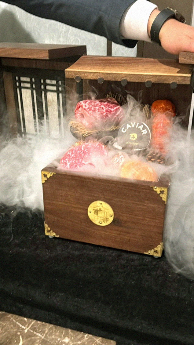 DAEBOJUNG Yeouido · the signature Hanwoo showing — marbled beef cuts and caviar presented in a display chest