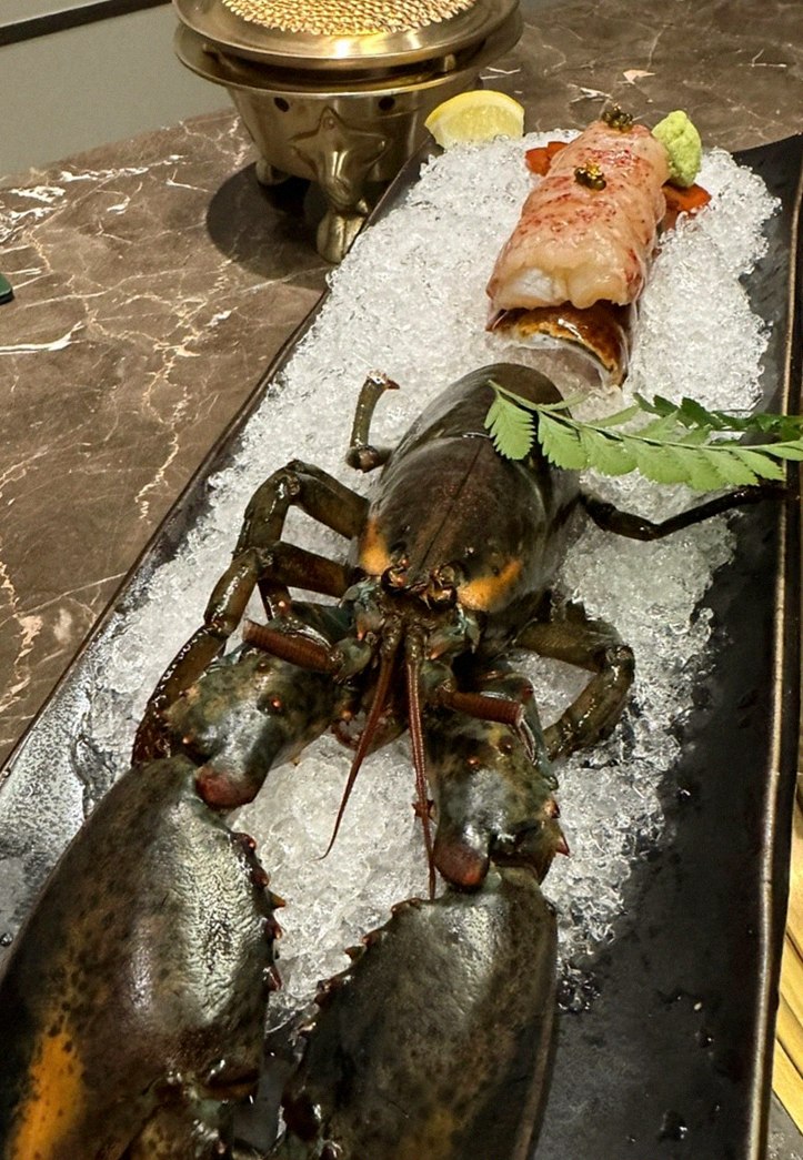 DAEBOJUNG Yeouido · the signature Hanwoo showing — marbled beef cuts and caviar presented in a display chest