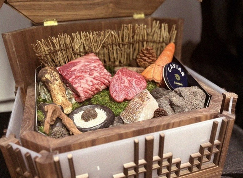 DAEBOJUNG Yeouido · the signature Hanwoo showing — marbled beef cuts and caviar presented in a display chest
