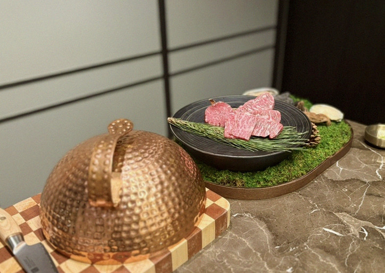 DAEBOJUNG Yeouido · the signature Hanwoo showing — marbled beef cuts and caviar presented in a display chest