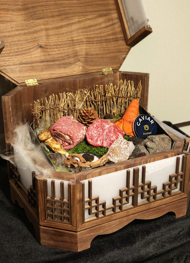 DAEBOJUNG Yeouido · the signature Hanwoo showing — marbled beef cuts and caviar presented in a display chest