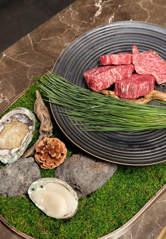 DAEBOJUNG Yeouido · the signature Hanwoo showing — marbled beef cuts and caviar presented in a display chest