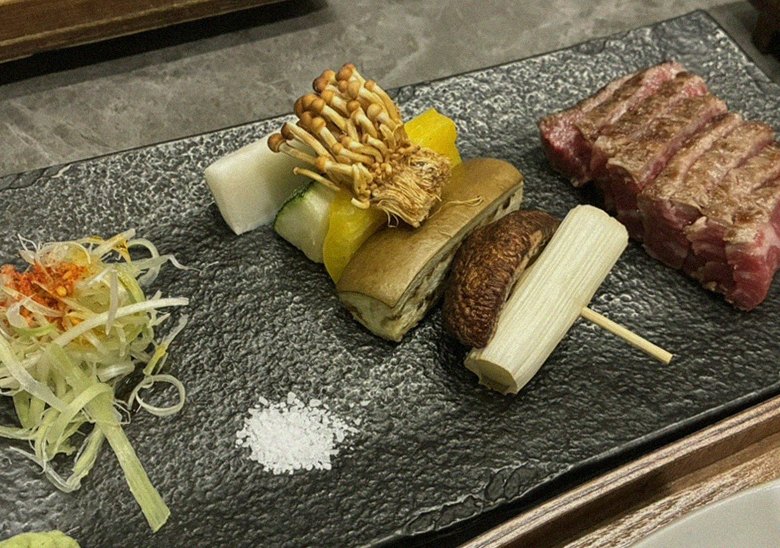 GOWOOGA Gwanghwamun · the signature Hanwoo showing — marbled beef cuts and caviar presented in a display chest