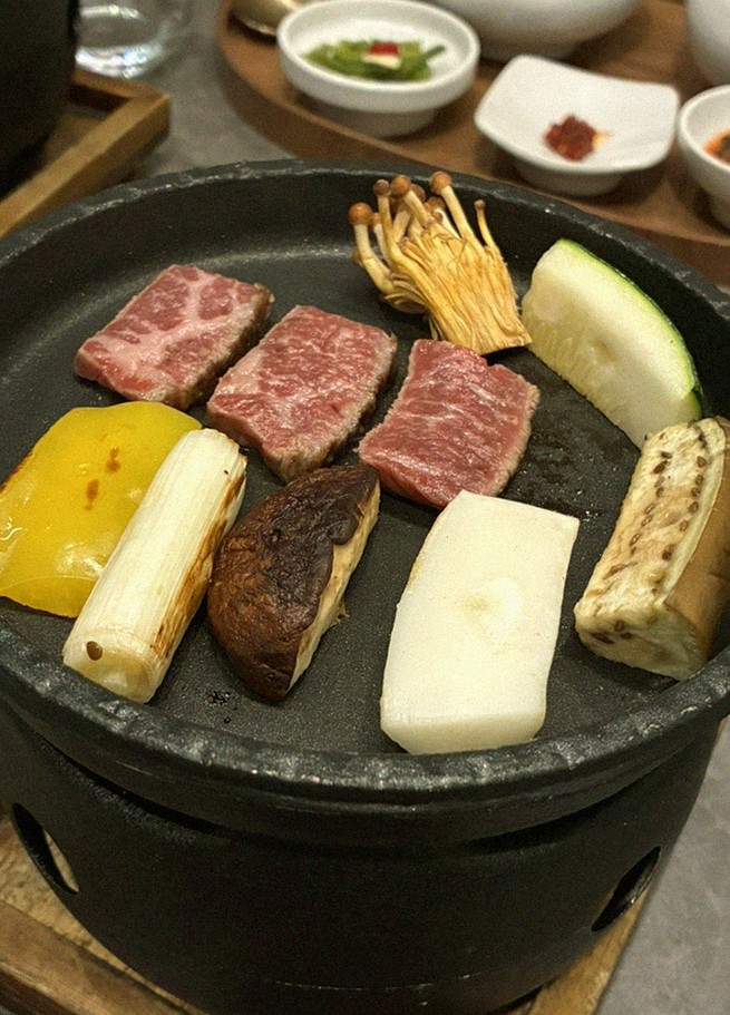 GOWOOGA Gwanghwamun · the signature Hanwoo showing — marbled beef cuts and caviar presented in a display chest