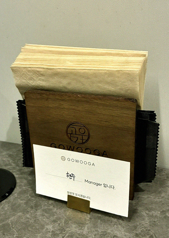 GOWOOGA Gwanghwamun · the signature Hanwoo showing — marbled beef cuts and caviar presented in a display chest