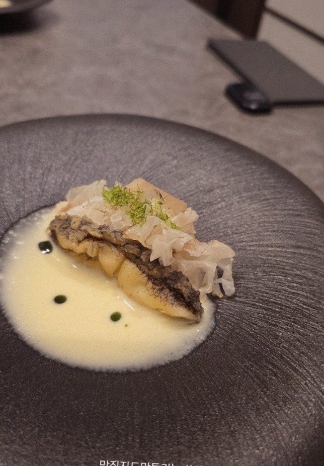 GOWOOGA Gwanghwamun · a plated course of Hanwoo beef