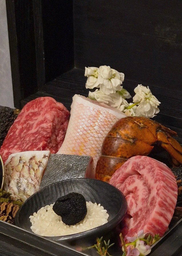GOWOOGA Gwanghwamun · the signature Hanwoo showing — marbled beef cuts and caviar presented in a display chest