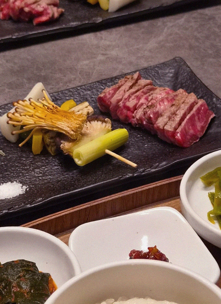 GOWOOGA Gwanghwamun · the signature Hanwoo showing — marbled beef cuts and caviar presented in a display chest