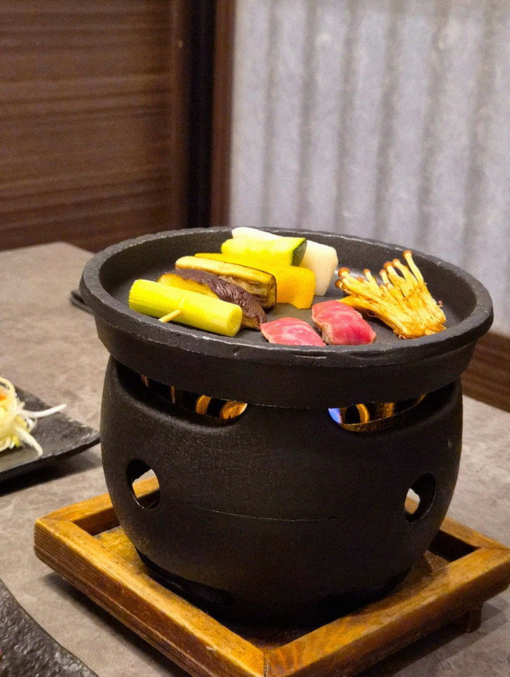 GOWOOGA Gwanghwamun · the signature Hanwoo showing — marbled beef cuts and caviar presented in a display chest