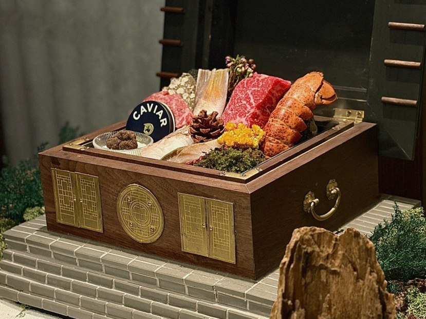 GOWOOGA Gangnam·Yeoksam · the signature Hanwoo showing — marbled beef cuts and caviar presented in a display chest