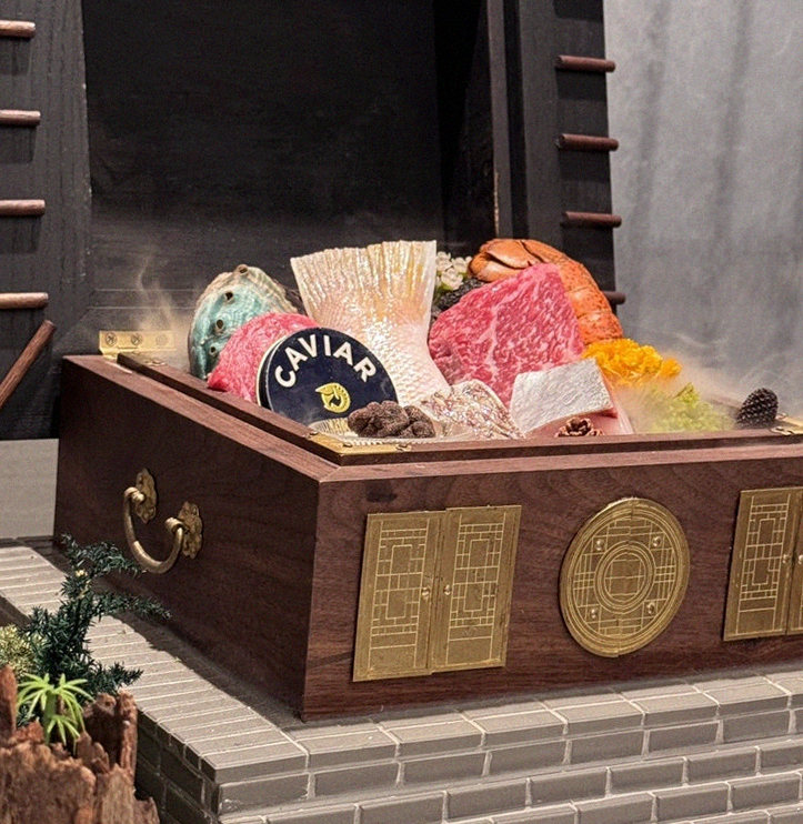 GOWOOGA Gangnam·Yeoksam · the signature Hanwoo showing — marbled beef cuts and caviar presented in a display chest