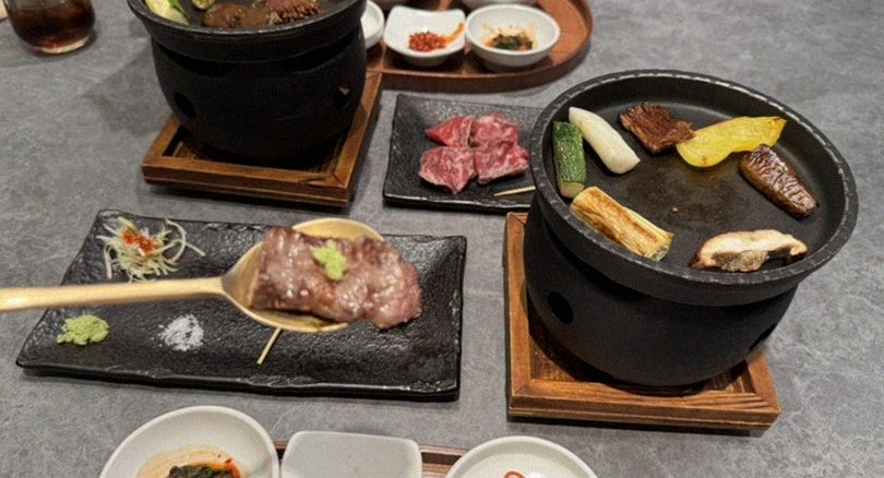 GOWOOGA Gangnam·Yeoksam · the signature Hanwoo showing — marbled beef cuts and caviar presented in a display chest