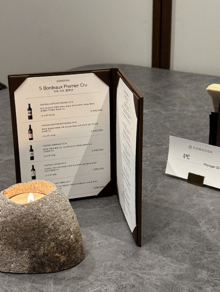 GOWOOGA Gangnam·Yeoksam · the signature Hanwoo showing — marbled beef cuts and caviar presented in a display chest