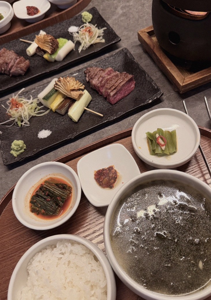 GOWOOGA Yeouido · the signature Hanwoo showing — marbled beef cuts and caviar presented in a display chest