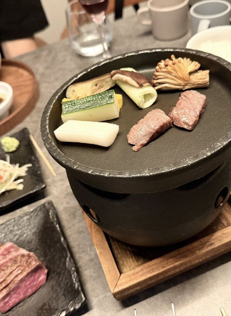 GOWOOGA Yeouido · the signature Hanwoo showing — marbled beef cuts and caviar presented in a display chest