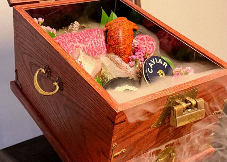 GOWOOGA Yeouido · the signature Hanwoo showing — marbled beef cuts and caviar presented in a display chest
