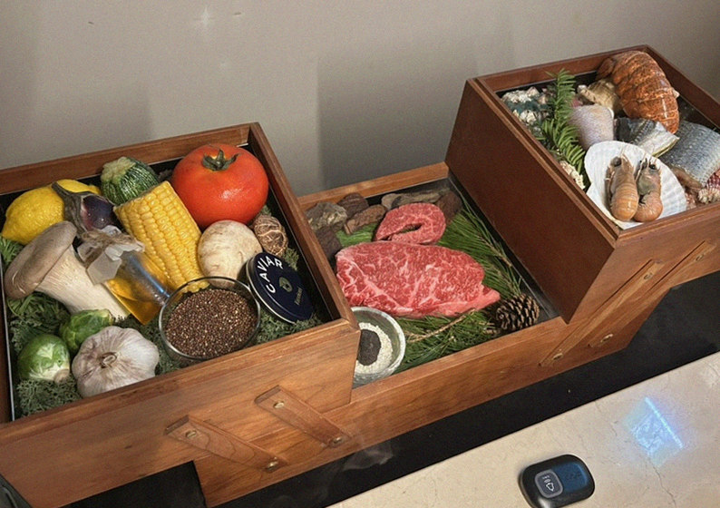 WOOARA Gwanghwamun · the signature Hanwoo showing — marbled beef cuts and caviar presented in a display chest
