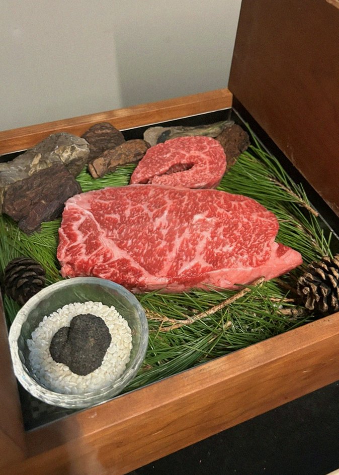 WOOARA Gwanghwamun · the signature Hanwoo showing — marbled beef cuts and caviar presented in a display chest