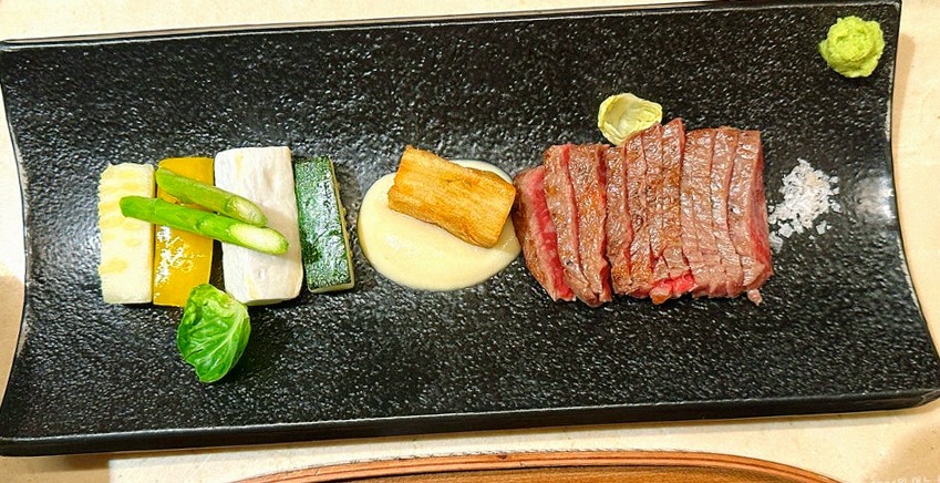 WOOARA Gwanghwamun · the signature Hanwoo showing — marbled beef cuts and caviar presented in a display chest