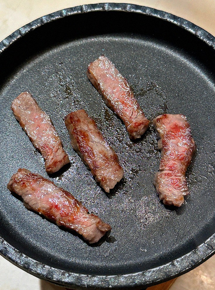 WOOARA Gwanghwamun · Hanwoo beef grilling over binchotan charcoal