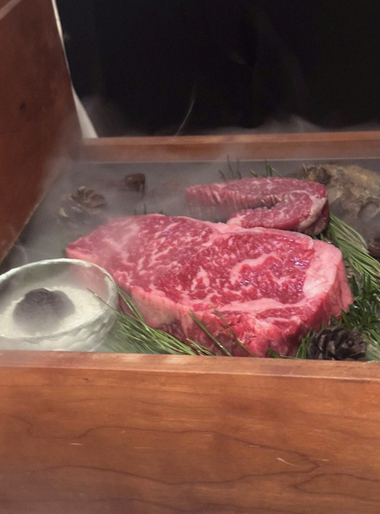 WOOARA Gwanghwamun · the signature Hanwoo showing — marbled beef cuts and caviar presented in a display chest