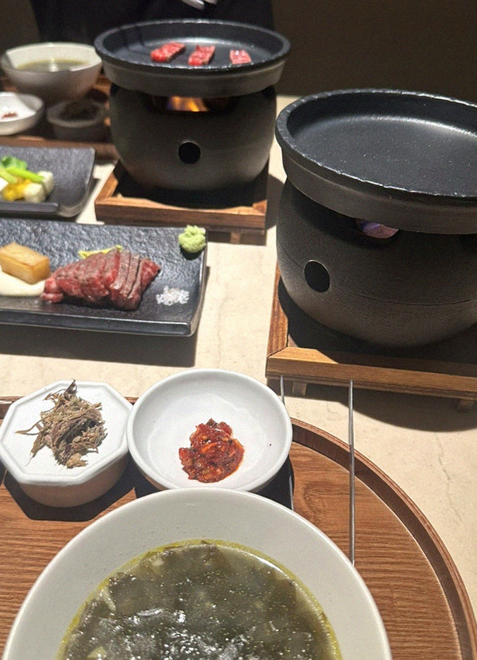 WOOARA Gwanghwamun · the signature Hanwoo showing — marbled beef cuts and caviar presented in a display chest