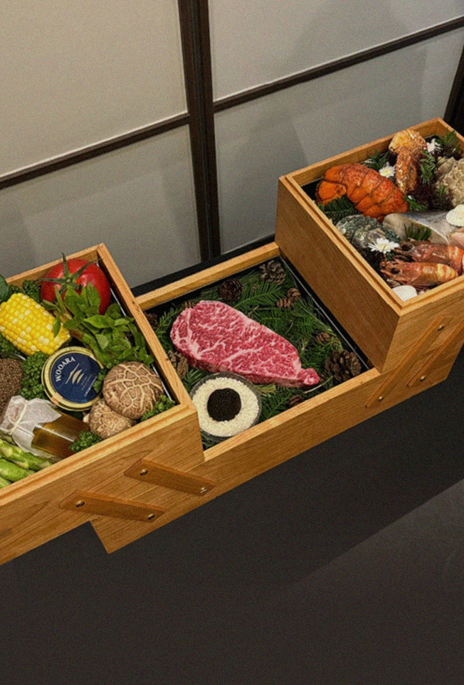 WOOARA Gwanghwamun · the signature Hanwoo showing — marbled beef cuts and caviar presented in a display chest