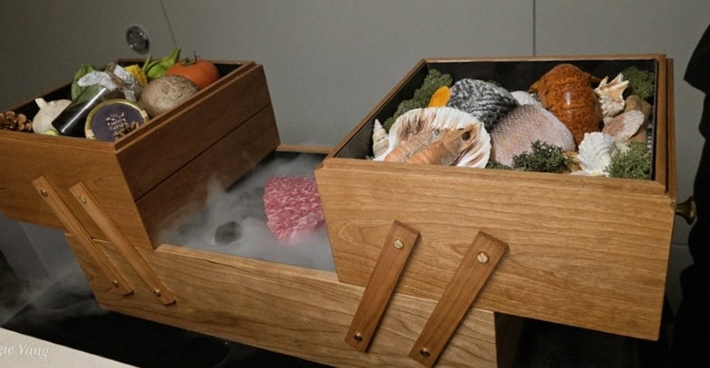 WOOARA Yeouido · the signature Hanwoo showing — marbled beef cuts and caviar presented in a display chest