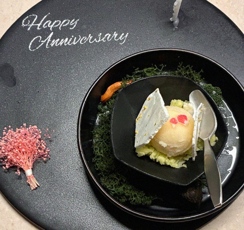 WOOARA Yeouido · the signature Hanwoo showing — marbled beef cuts and caviar presented in a display chest