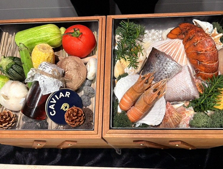 WOOARA Yeouido · the signature Hanwoo showing — marbled beef cuts and caviar presented in a display chest