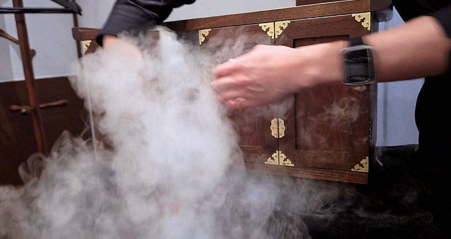 WOOHANA Jonggak · the signature Hanwoo showing — marbled beef cuts and caviar presented in a display chest