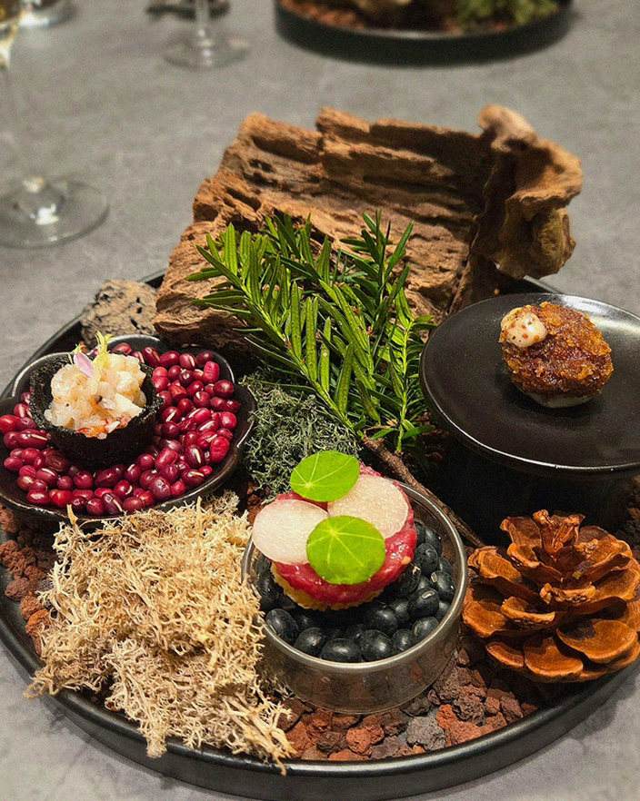WOOHANA Jonggak · the signature Hanwoo showing — marbled beef cuts and caviar presented in a display chest