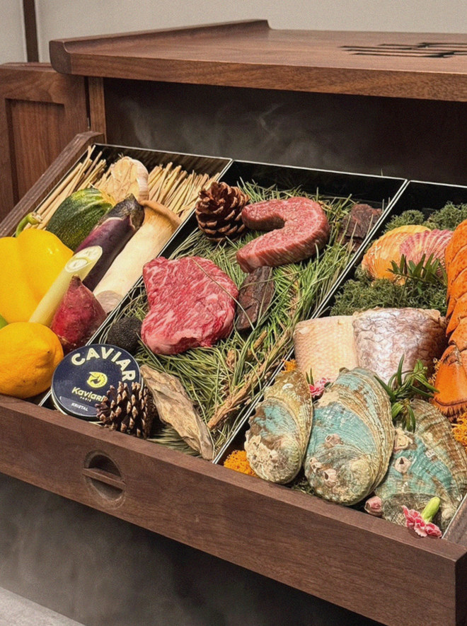 WOOHANA Jonggak · the signature Hanwoo showing — marbled beef cuts and caviar presented in a display chest