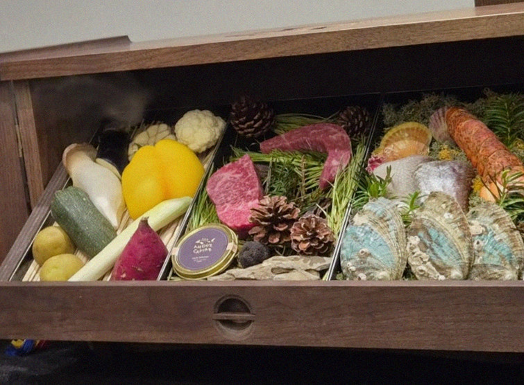 WOOHANA Jonggak · the signature Hanwoo showing — marbled beef cuts and caviar presented in a display chest