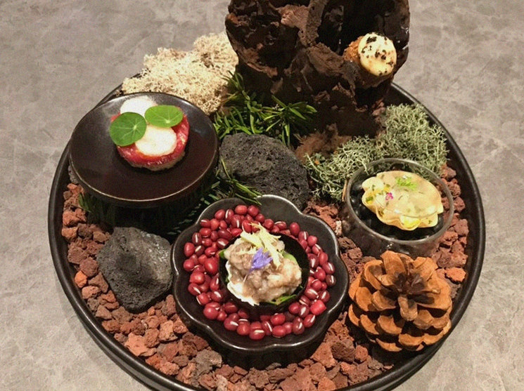 WOOHANA Yeouido · the signature Hanwoo showing — marbled beef cuts and caviar presented in a display chest