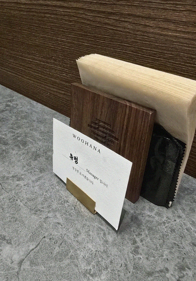WOOHANA Yeouido · the signature Hanwoo showing — marbled beef cuts and caviar presented in a display chest