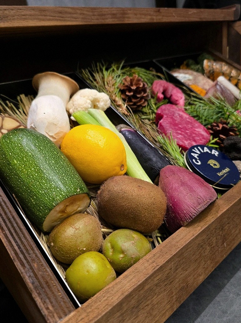 WOOHANA Yeouido · the signature Hanwoo showing — marbled beef cuts and caviar presented in a display chest