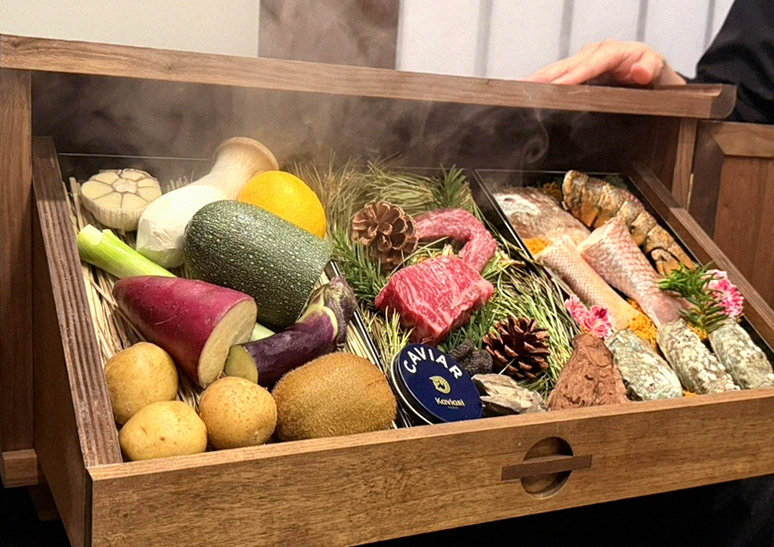 WOOHANA Yeouido · the signature Hanwoo showing — marbled beef cuts and caviar presented in a display chest