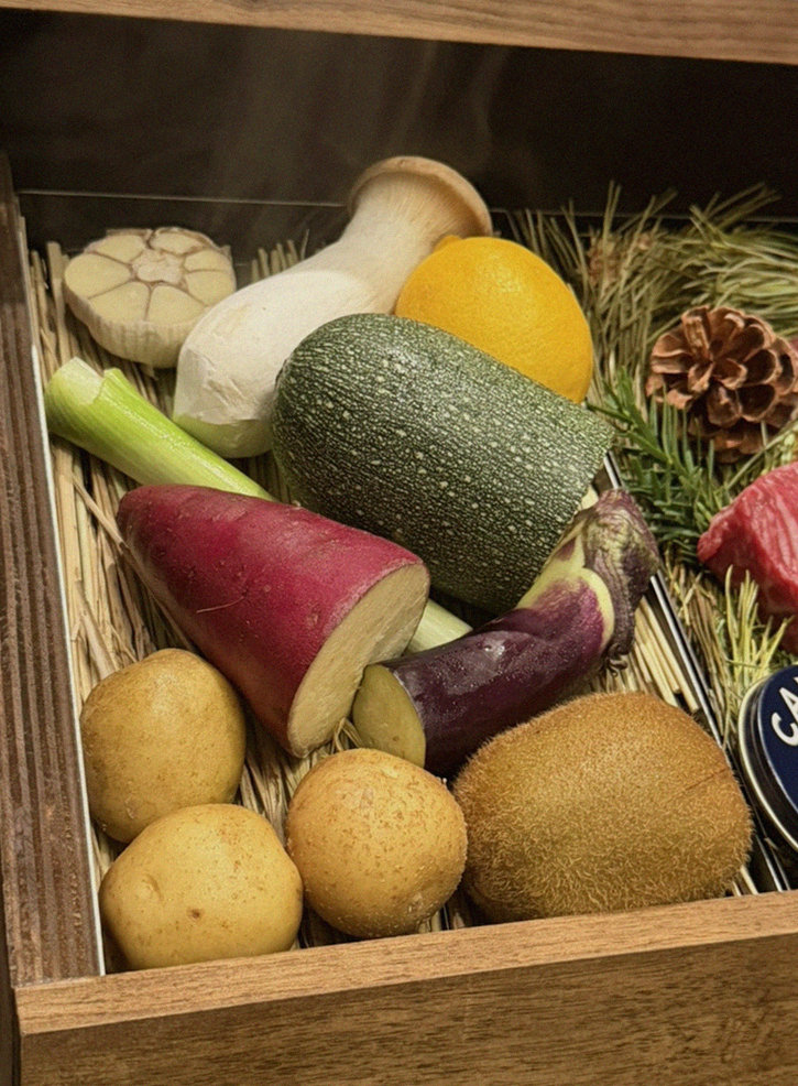 WOOHANA Yeouido · the signature Hanwoo showing — marbled beef cuts and caviar presented in a display chest