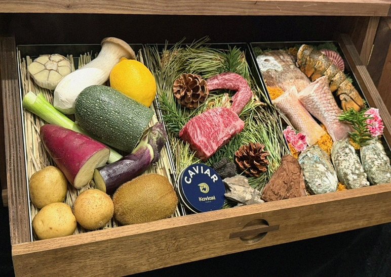 WOOHANA Yeouido · the signature Hanwoo showing — marbled beef cuts and caviar presented in a display chest