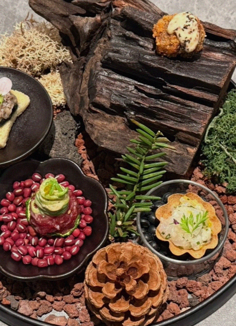 WOOHANA Jonggak · the signature Hanwoo showing — marbled beef cuts and caviar presented in a display chest
