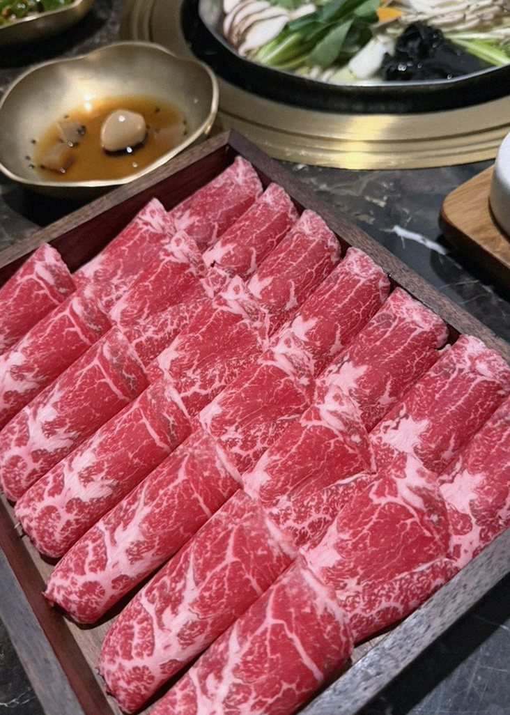 DAEBOJUNG City Hall · premium marbled Hanwoo beef presented before grilling