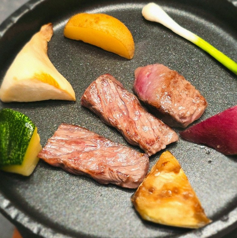 WOOHANA Jonggak · the signature Hanwoo showing — marbled beef cuts and caviar presented in a display chest