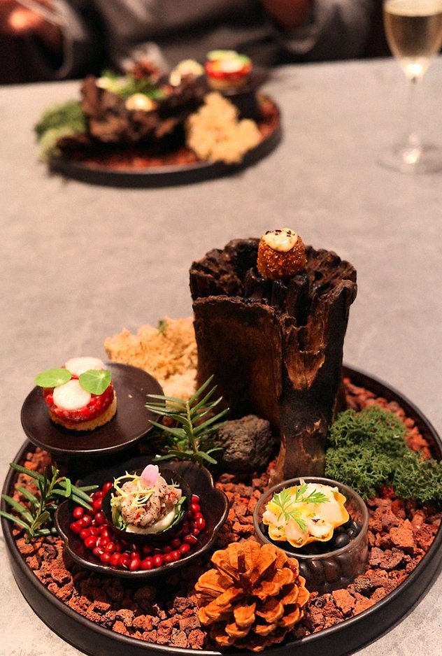 WOOHANA Jonggak · the signature Hanwoo showing — marbled beef cuts and caviar presented in a display chest