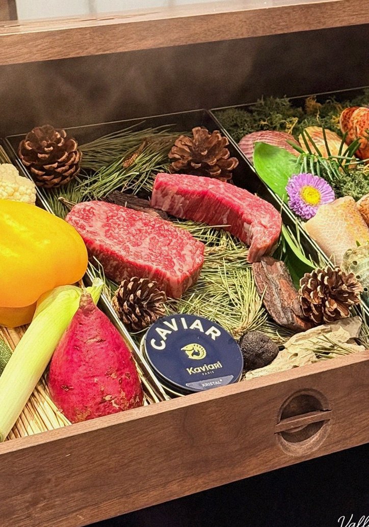 WOOHANA Yeouido · the signature Hanwoo showing — marbled beef cuts and caviar presented in a display chest