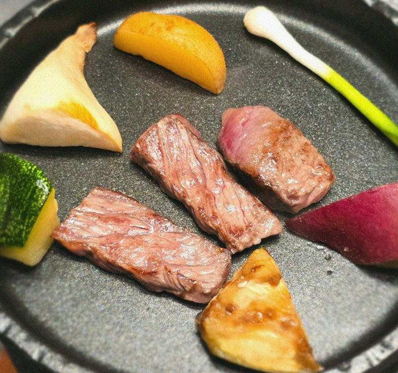 WOOHANA Jonggak · the signature Hanwoo showing — marbled beef cuts and caviar presented in a display chest