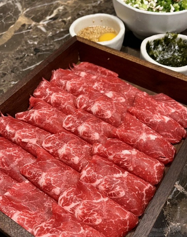 DAEBOJUNG City Hall · premium marbled Hanwoo beef presented before grilling